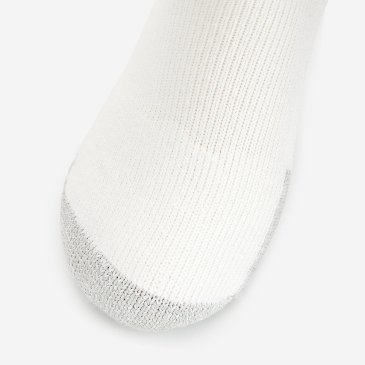 Thorlos white tennis micro mini sock with grey cushioned toe detail on clean background