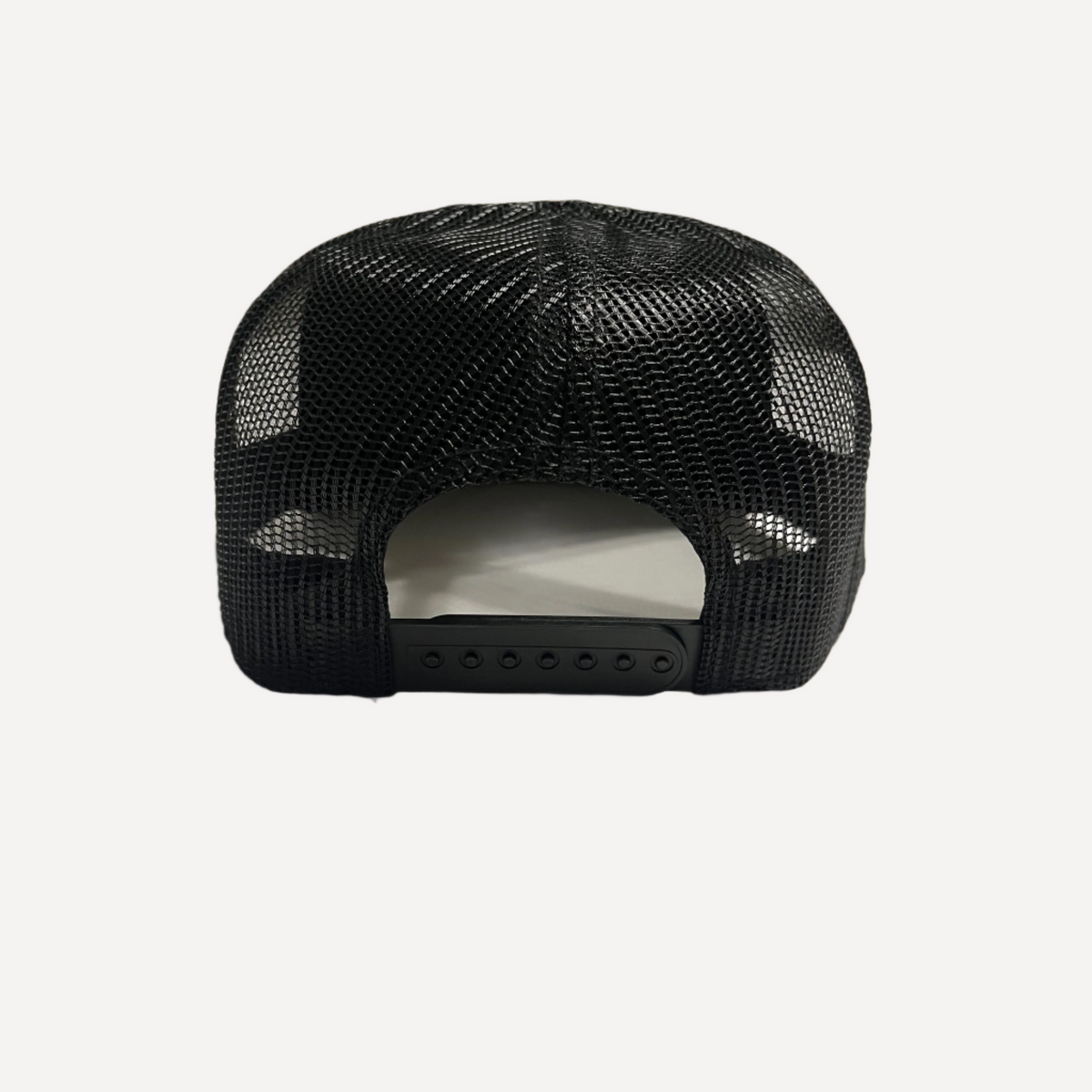 Back view of black mesh trucker hat with snapback closure by LEGG
