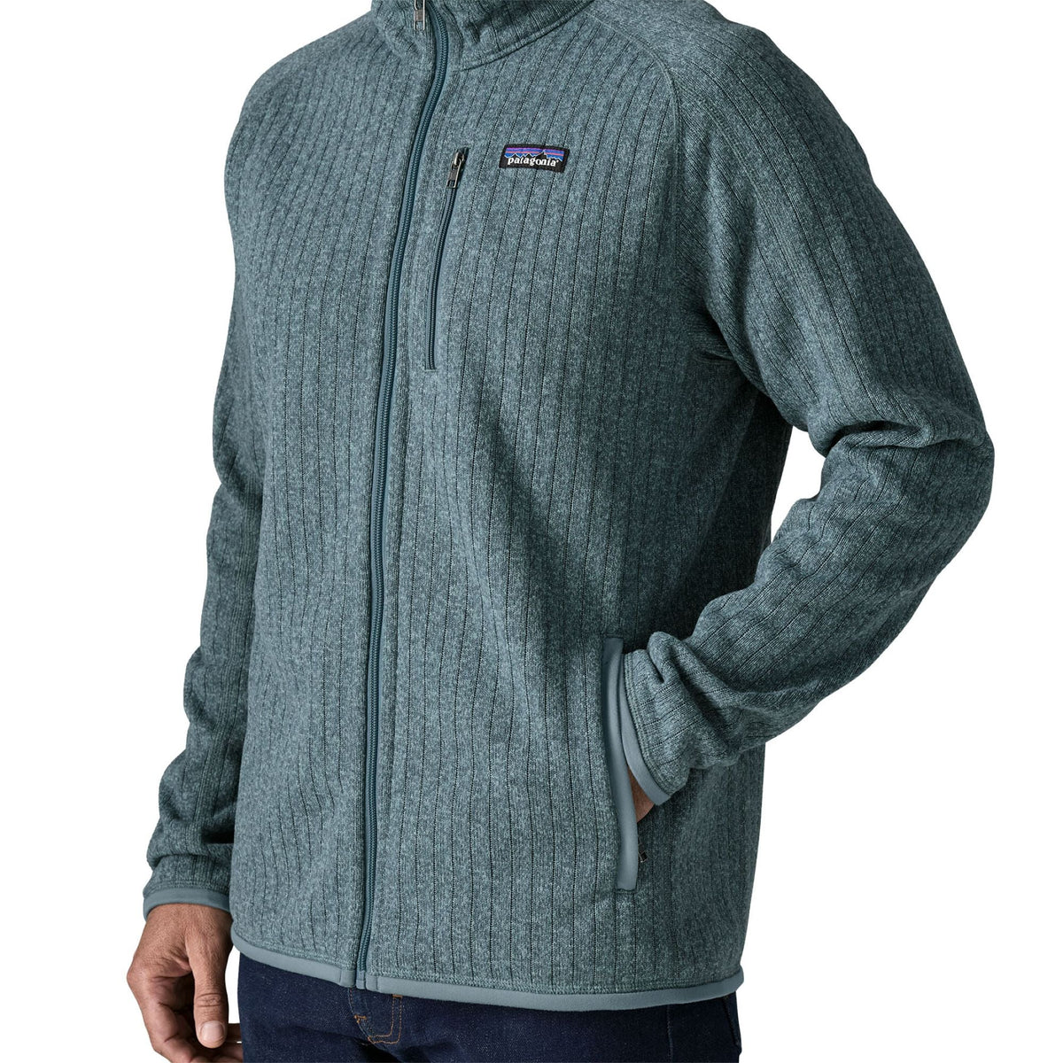 Man wearing Patagonia Better Sweater Fleece Jacket in Blue Sage rib knit, three-quarter front view