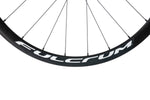 Close-up of Fulcrum wheel rim showing full brand name lettering on black carbon rim