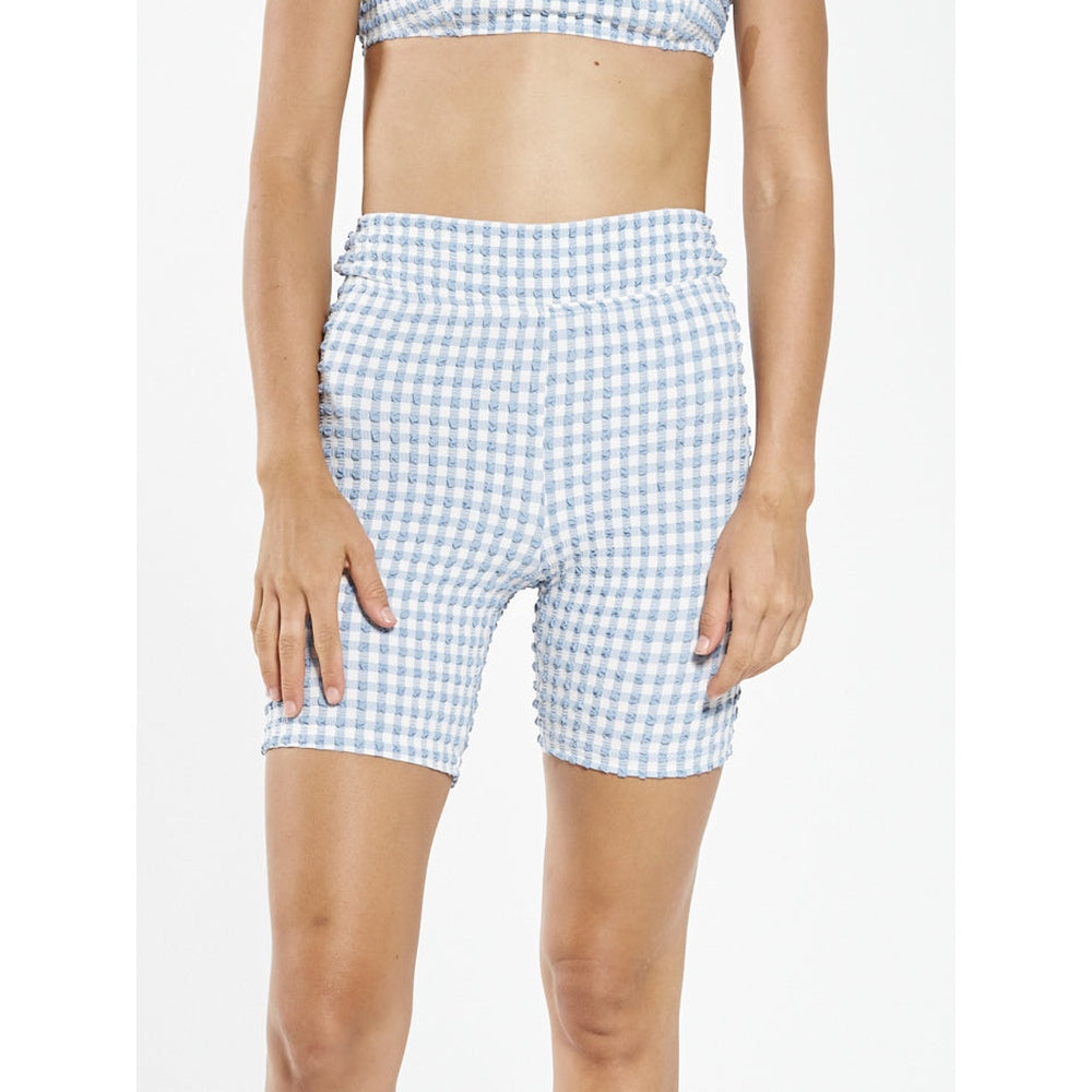Women's blue and white gingham seersucker bike shorts with high waistband on model