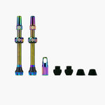 Muc-Off tubeless valve kit with iridescent rainbow finish, two valves and rubber components