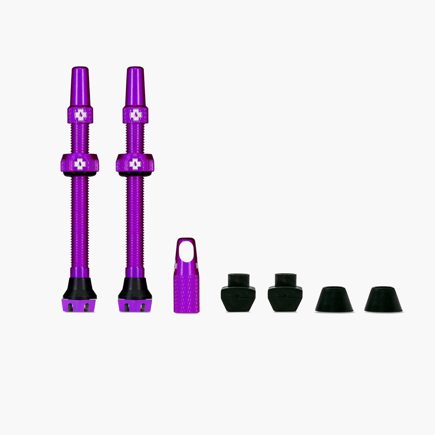 Muc-Off purple tubeless valve kit with two valves and rubber accessories