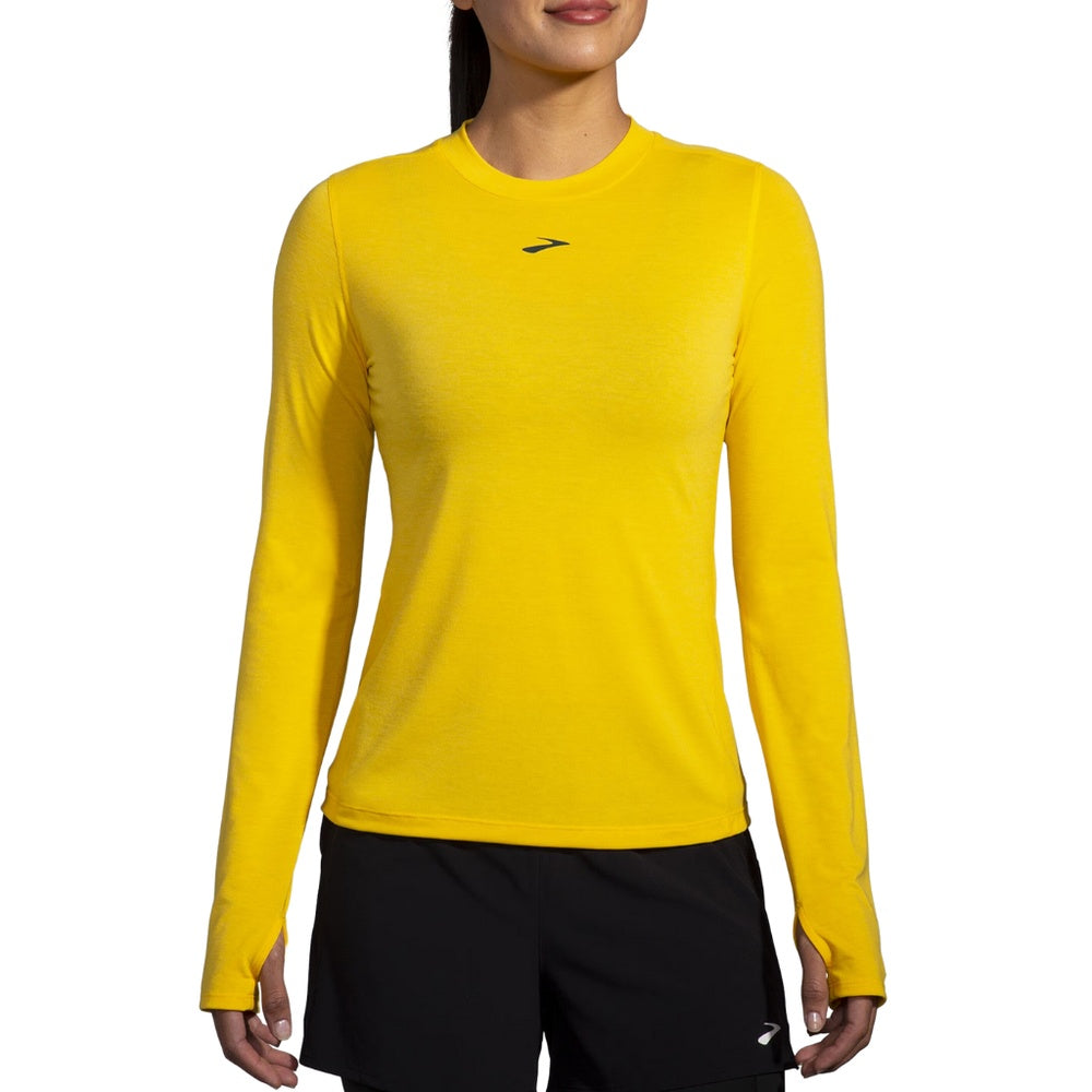 Brooks High Point Long Sleeve in Lemon Chrome yellow worn by female model on white background