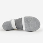 Bottom sole view of Thorlos Experia Energy sock in heathered gray with white stripes