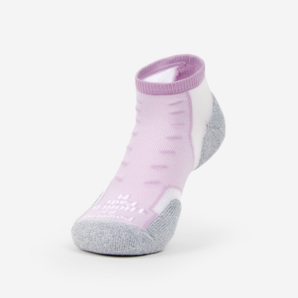 Thorlos Experia TechFit ankle sock in pink and white with gray cushioning, front view.