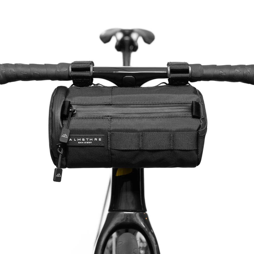 ALMSTHRE Compact Bar Bag in black mounted on bicycle handlebars