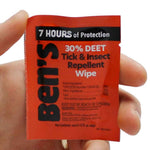 Hand holding single Ben's 30% DEET Tick and Insect Repellent Wipe individual packet, pocket-sized