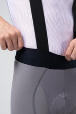 Gobik Absolute 7.0 bib shorts in gray with black straps and white mesh jersey