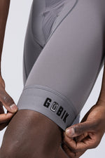 GOBIK gray cycling bib shorts showing leg hem detail and brand logo