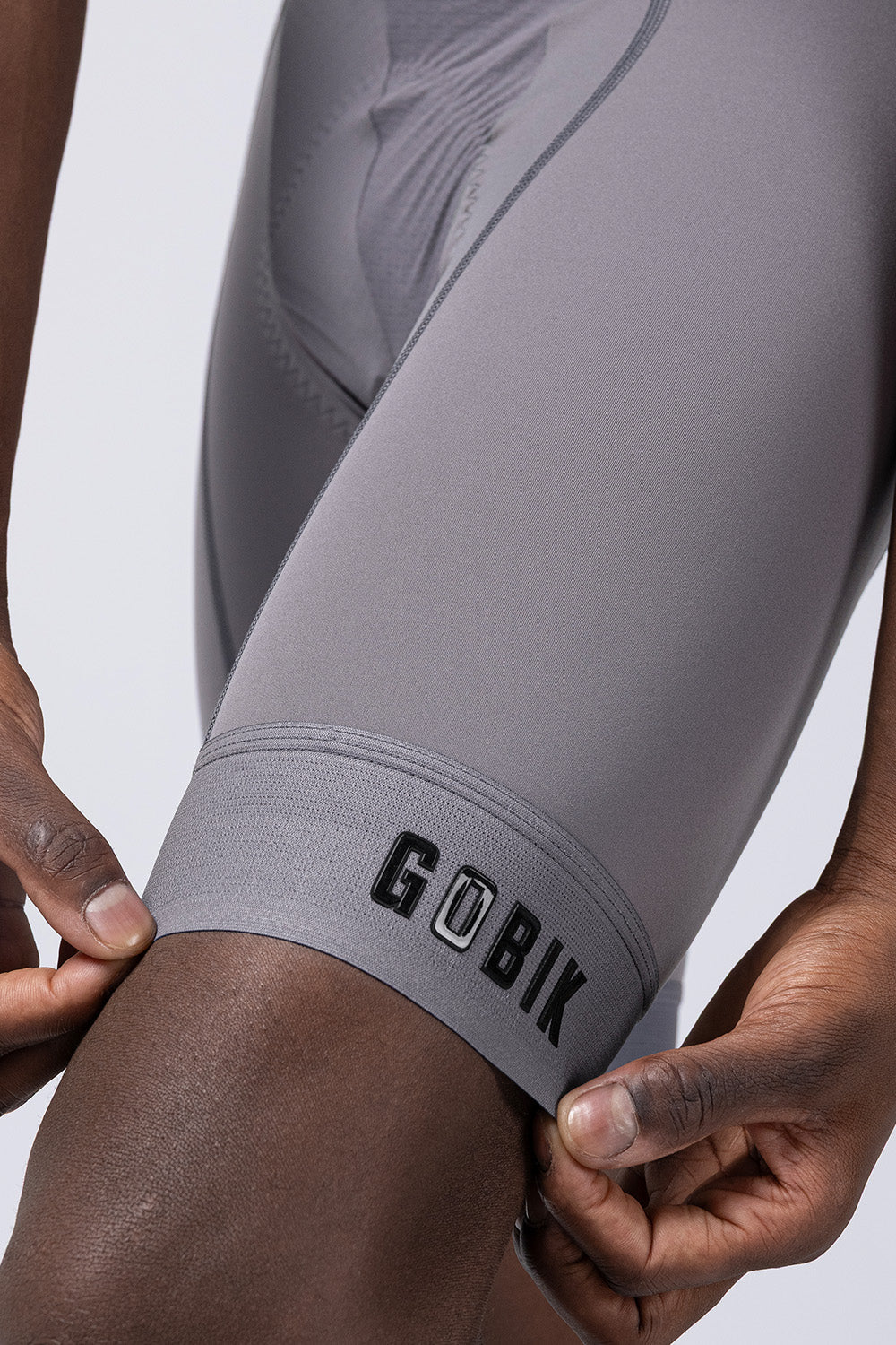 GOBIK gray cycling bib shorts showing leg hem detail and brand logo