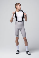 Gobik Artic Stride men's bib shorts in tapioca gray with black suspenders, front view