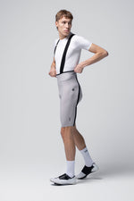 Gobik Artic Stride men's bib shorts tapioca colorway shown from side angle on model