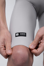 Close-up of Gobik Nonconformist label on leg hem of Artic Stride bib shorts in tapioca