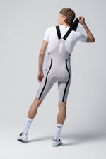 Rear view of Gobik Artic Stride men's bib shorts in tapioca showing chamois pad and black straps