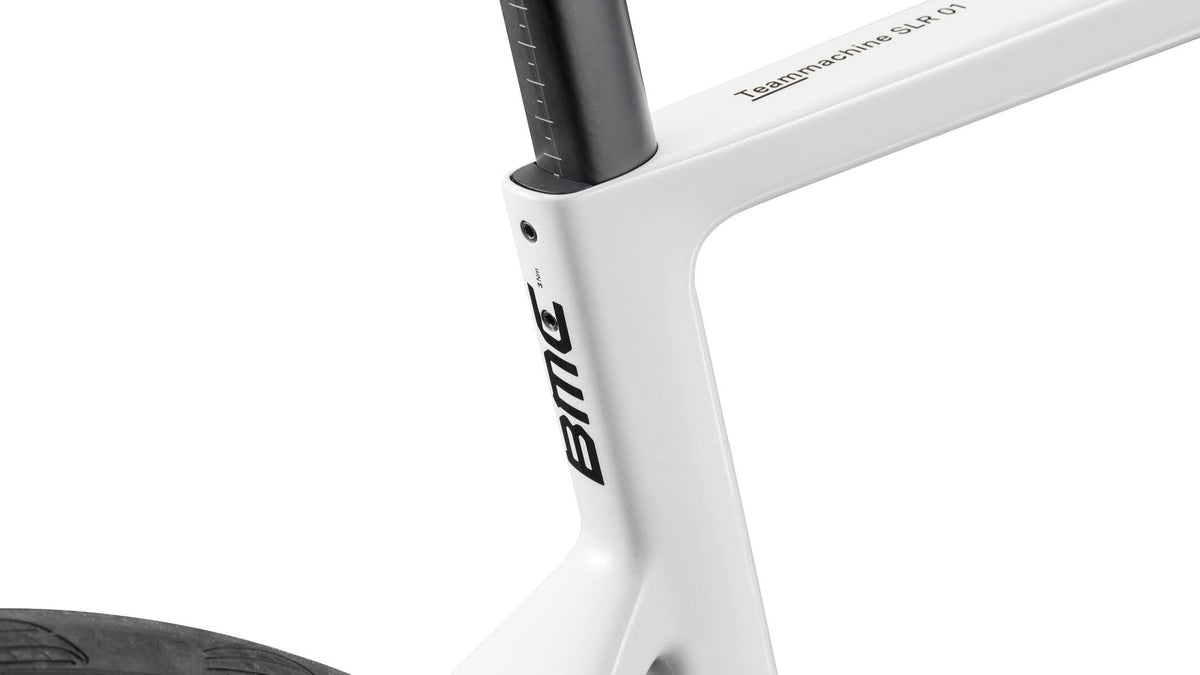 Close-up of BMC Teammachine SLR 01 seat tube junction showing model name decal in white