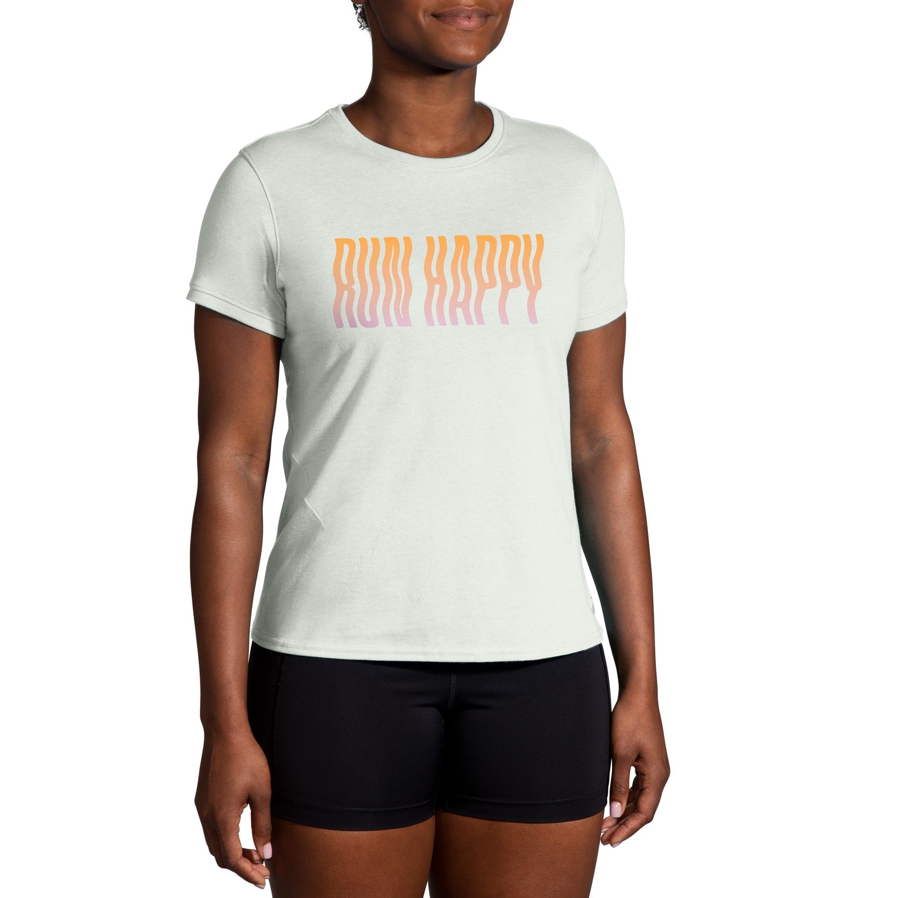 Women wearing Brooks Distance Short Sleeve 2.0 shirt in mint green with Run Happy text