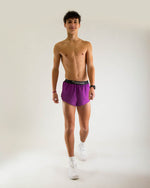 Man wearing Chicknlegs deep purple 2-inch split running shorts with black waistband