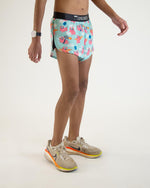 ChicknLegs men's split running shorts with flying pigs print on light blue background