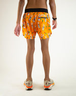 ChicknLegs 4-inch half split running shorts in orange Bad Bunny print, rear view