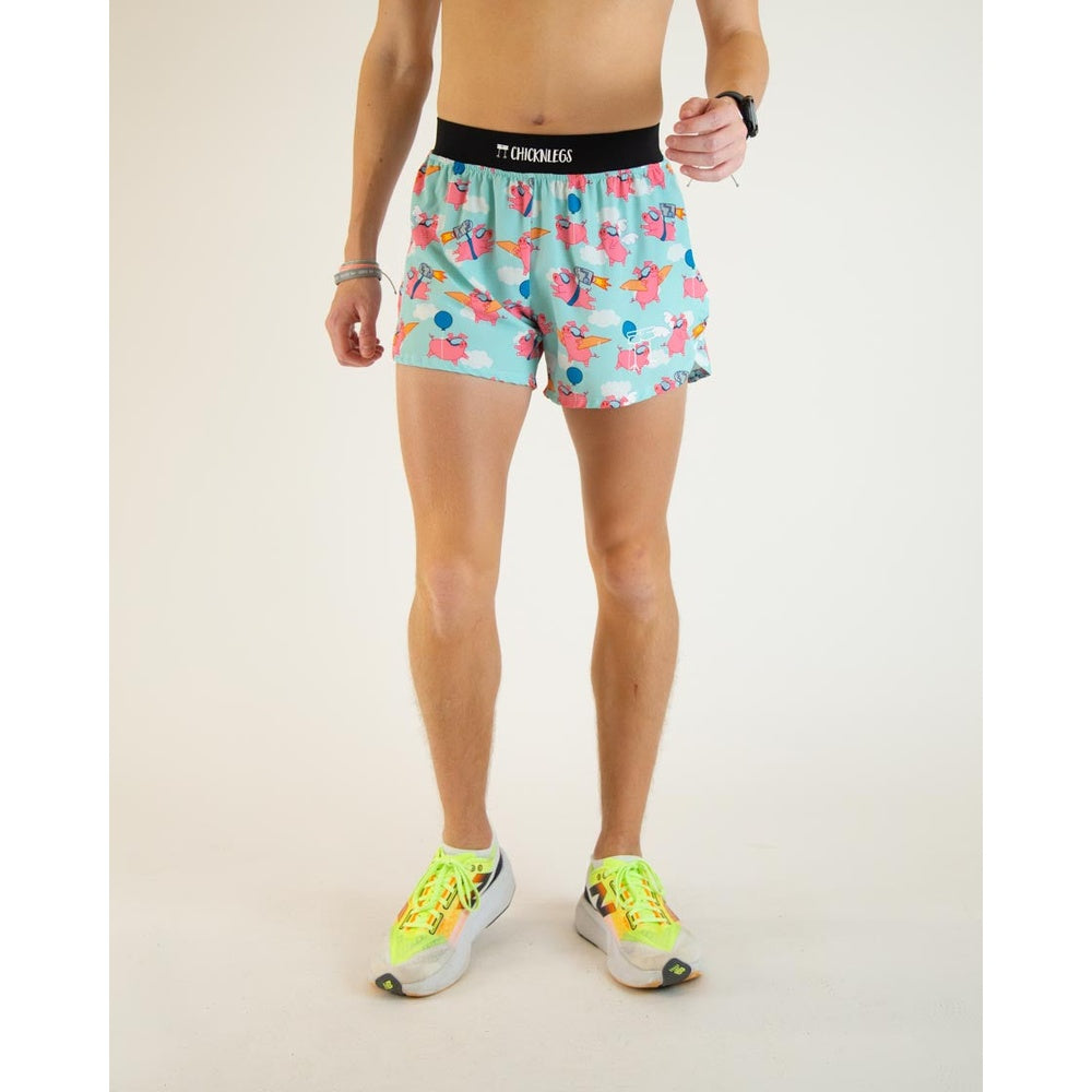 ChicknLegs men's running shorts with flying pig pattern in turquoise