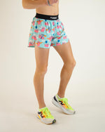ChicknLegs running shorts with flying pig pattern on light blue background