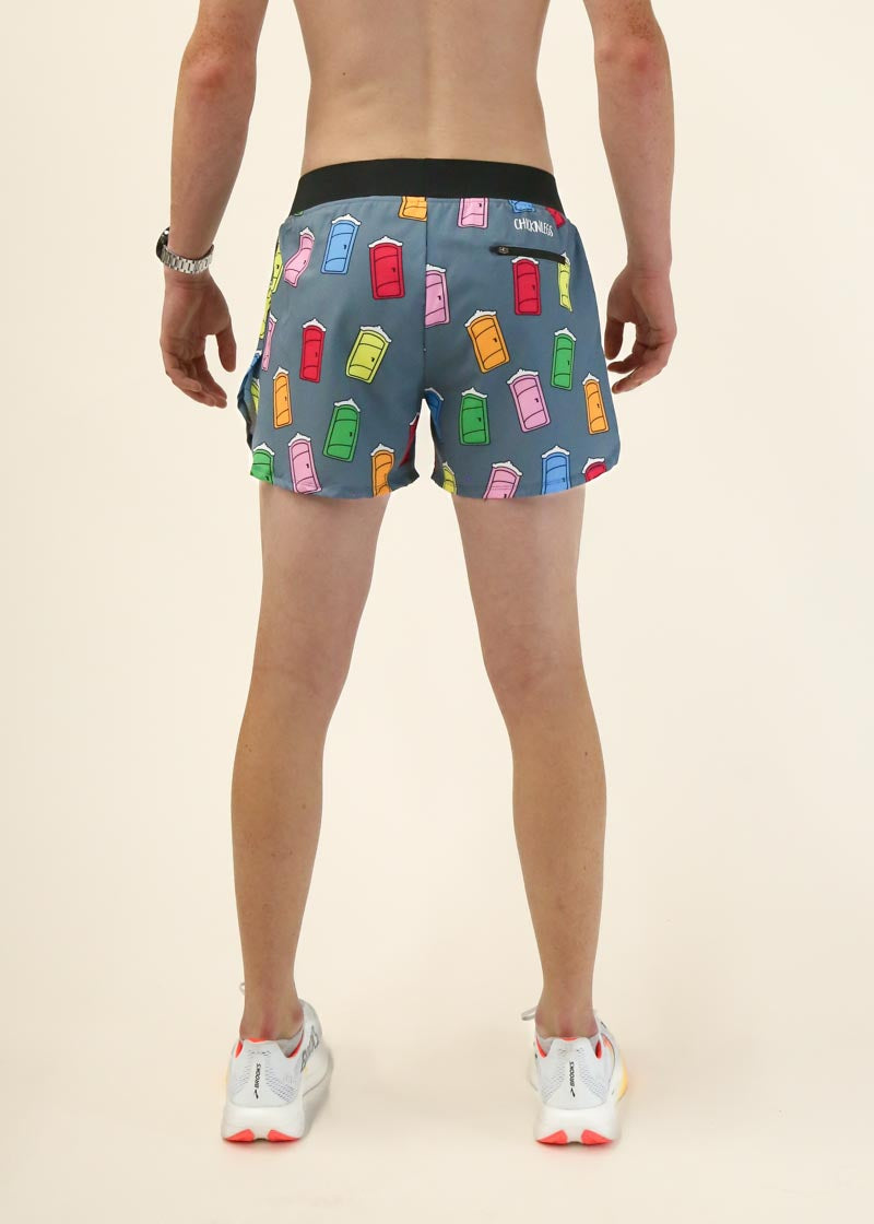 Man wearing ChicknLegs shorts with colorful milk carton print on dark background