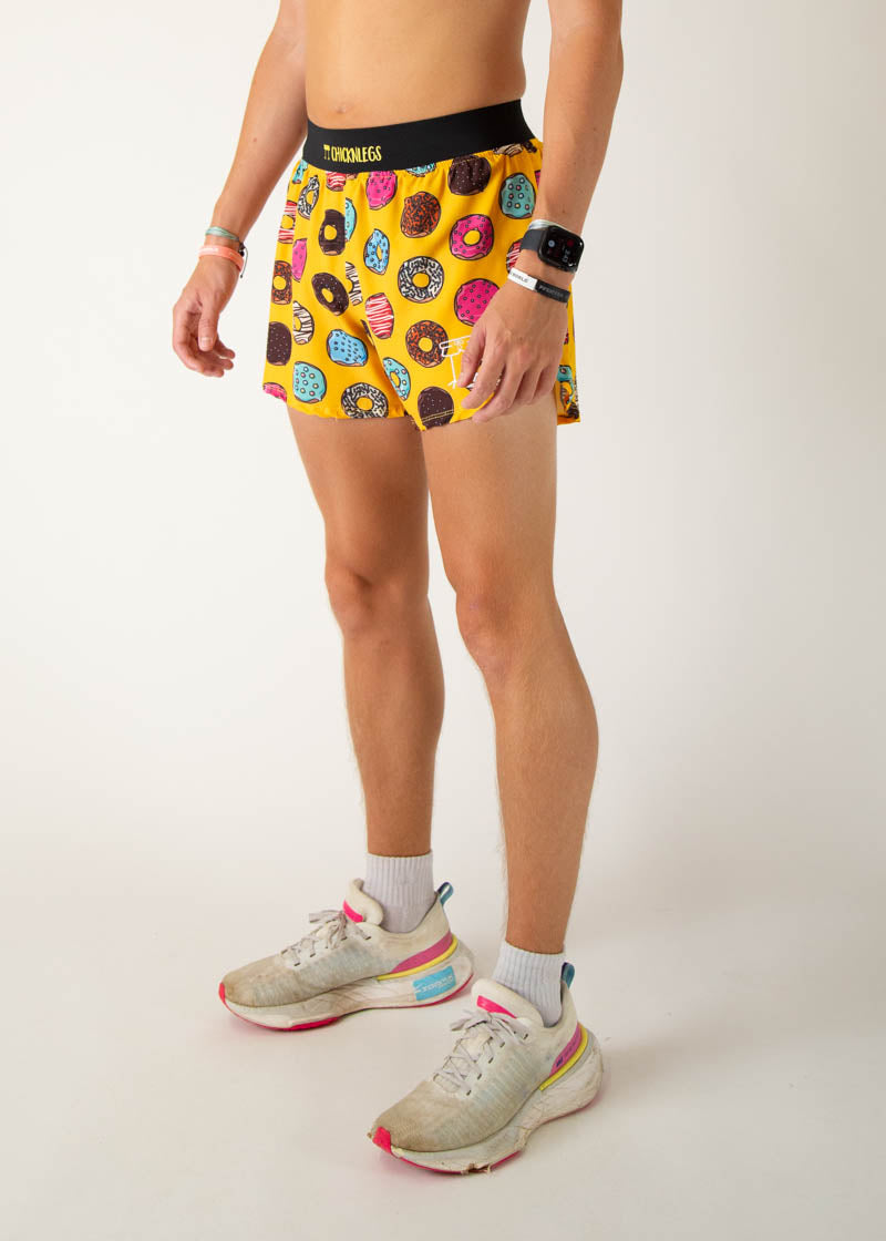 ChicknLegs men's yellow running shorts with colorful donut print pattern