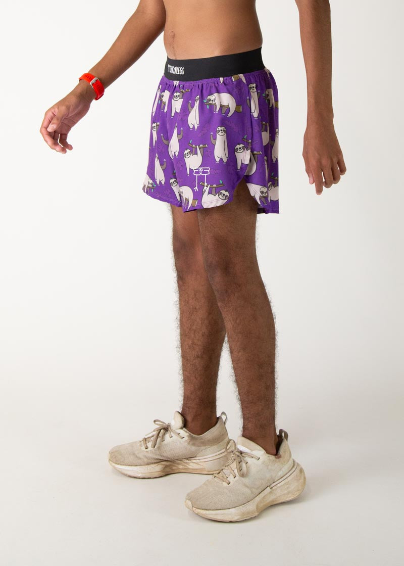 Man wearing purple ChicknLegs running shorts with sloth pattern and 4-inch inseam