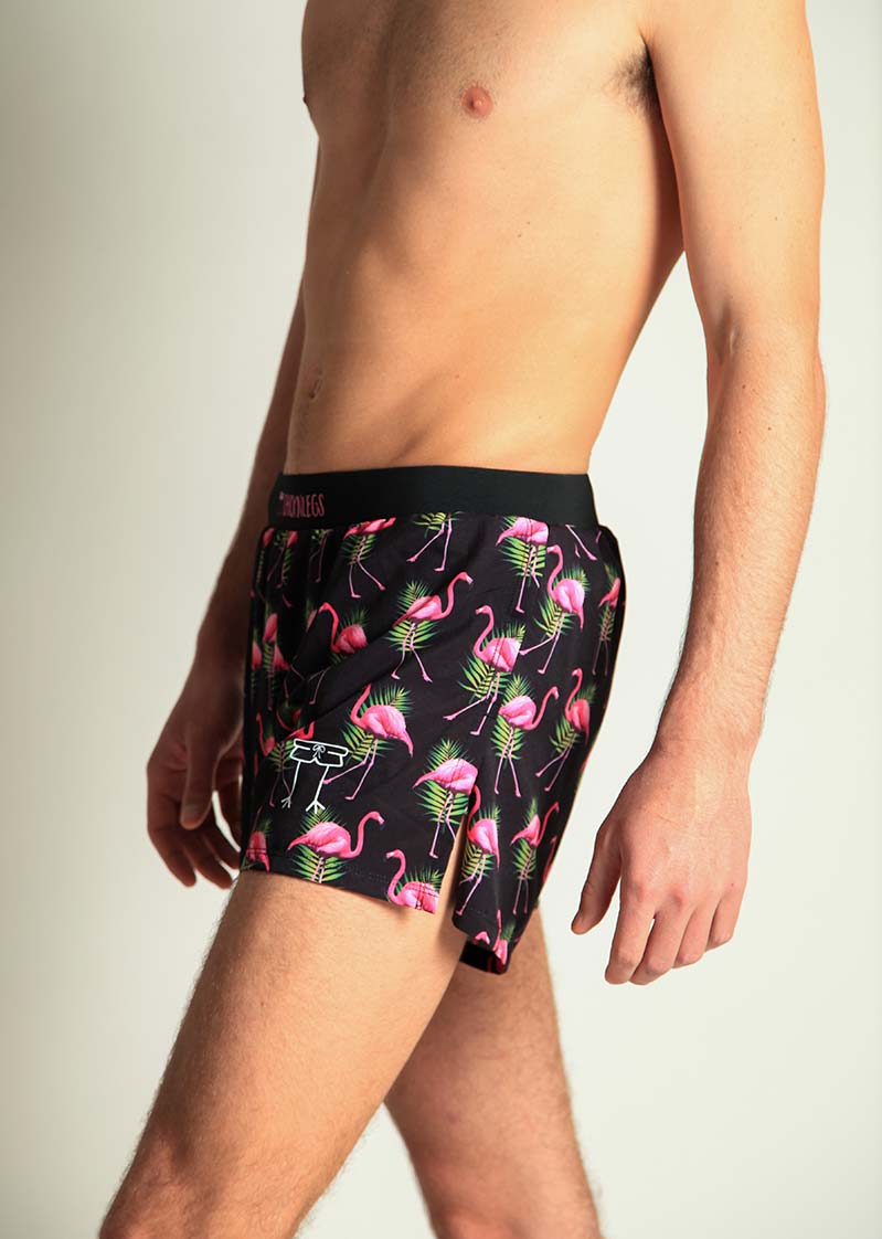 ChicknLegs men's black swim shorts with pink flamingo and tropical leaf print