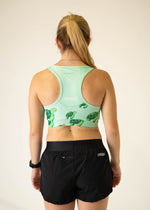 ChicknLegs OG Sports Bra in sea turtle pattern, mint green background, back view