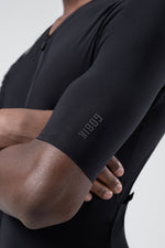 Close-up of Gobik black cycling jersey sleeve showing brand logo detail on arm
