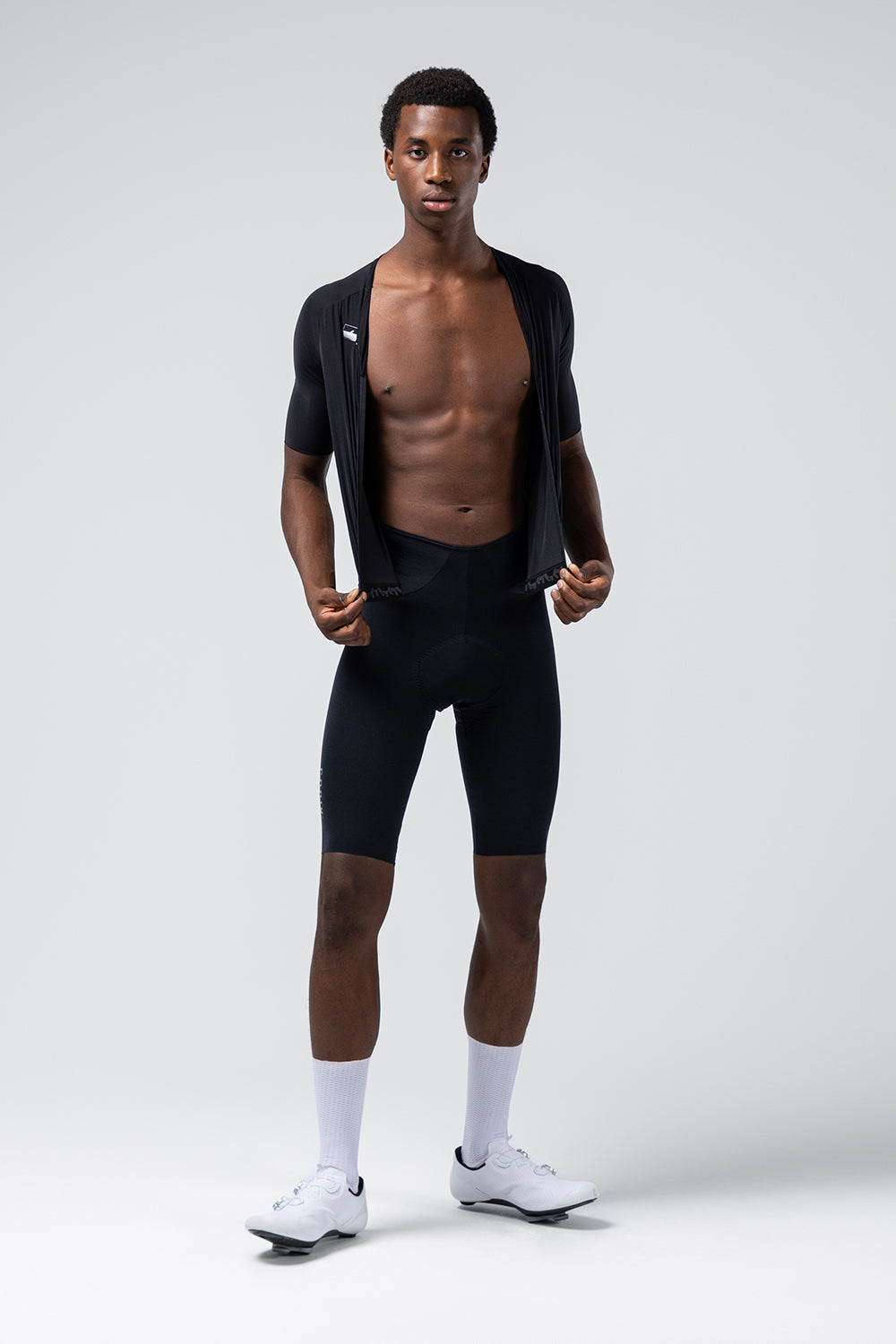 Gobik Integral Hudson Solid Men black cycling suit shown open on model revealing bib shorts