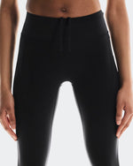Close-up of On Running Performance Tights 7/8 waistband with drawstring and side pockets