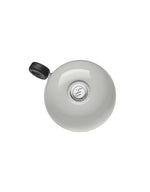 Electra bicycle bell in light gray with black thumb trigger
