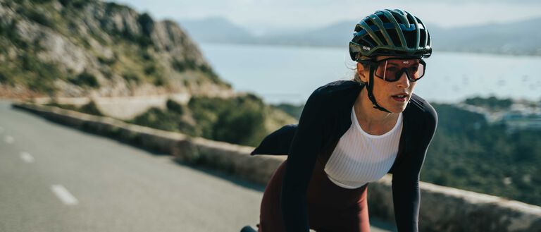 Cyclist wearing Kask Valegro helmet in anthracite mat during outdoor ride
