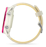 Garmin Forerunner smartwatch with cream case, pink accents, and light colored band