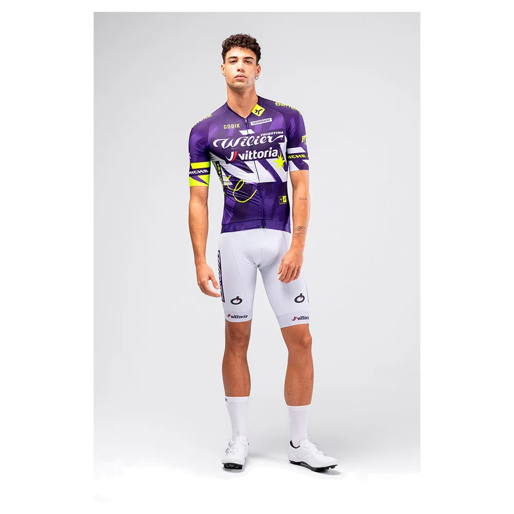 Male model wearing Gobik CX Pro 4.0 violet jersey with white Wilier Vittoria bib shorts full outfit