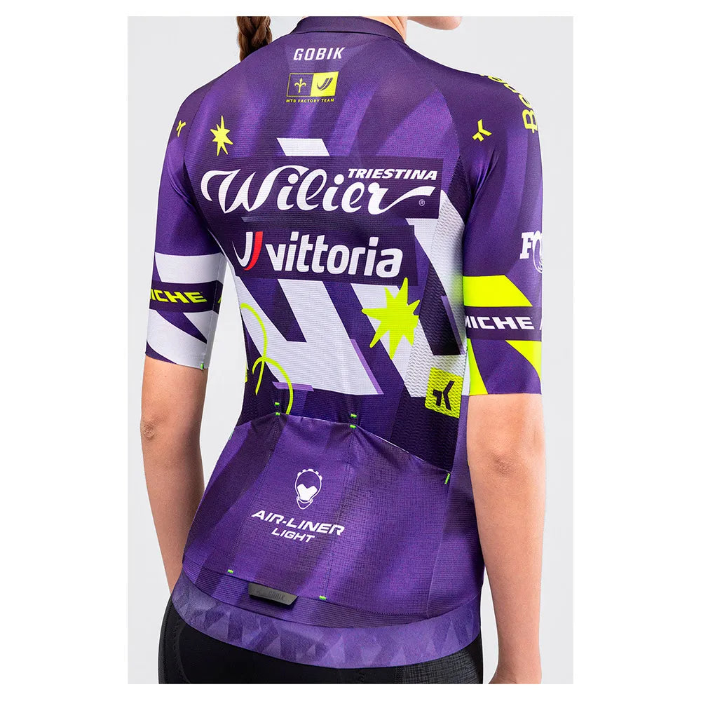 Female model showing rear view of Gobik CX Pro 4.0 violet cycling jersey with Air-Liner Light back pockets