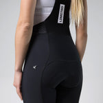 Close-up rear view of Gobik Limited 6.0 black bib shorts showing chamois pad and Gobik logo