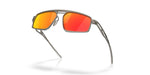 Oakley Bushwick sunglasses matte gunmetal frame with Prizm Ruby red mirror lenses, floating artistic angle
