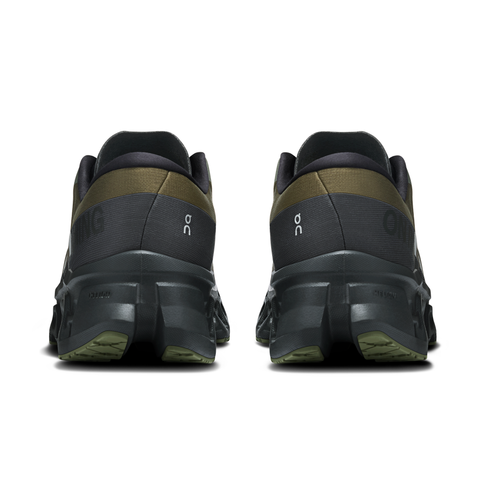 On Cloudmonster 3 running shoes in olive and eclipse colorway, rear view
