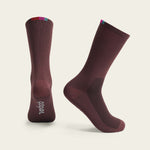 Velocio Terra cycling socks in burgundy with colorful cuff details, professional studio shot