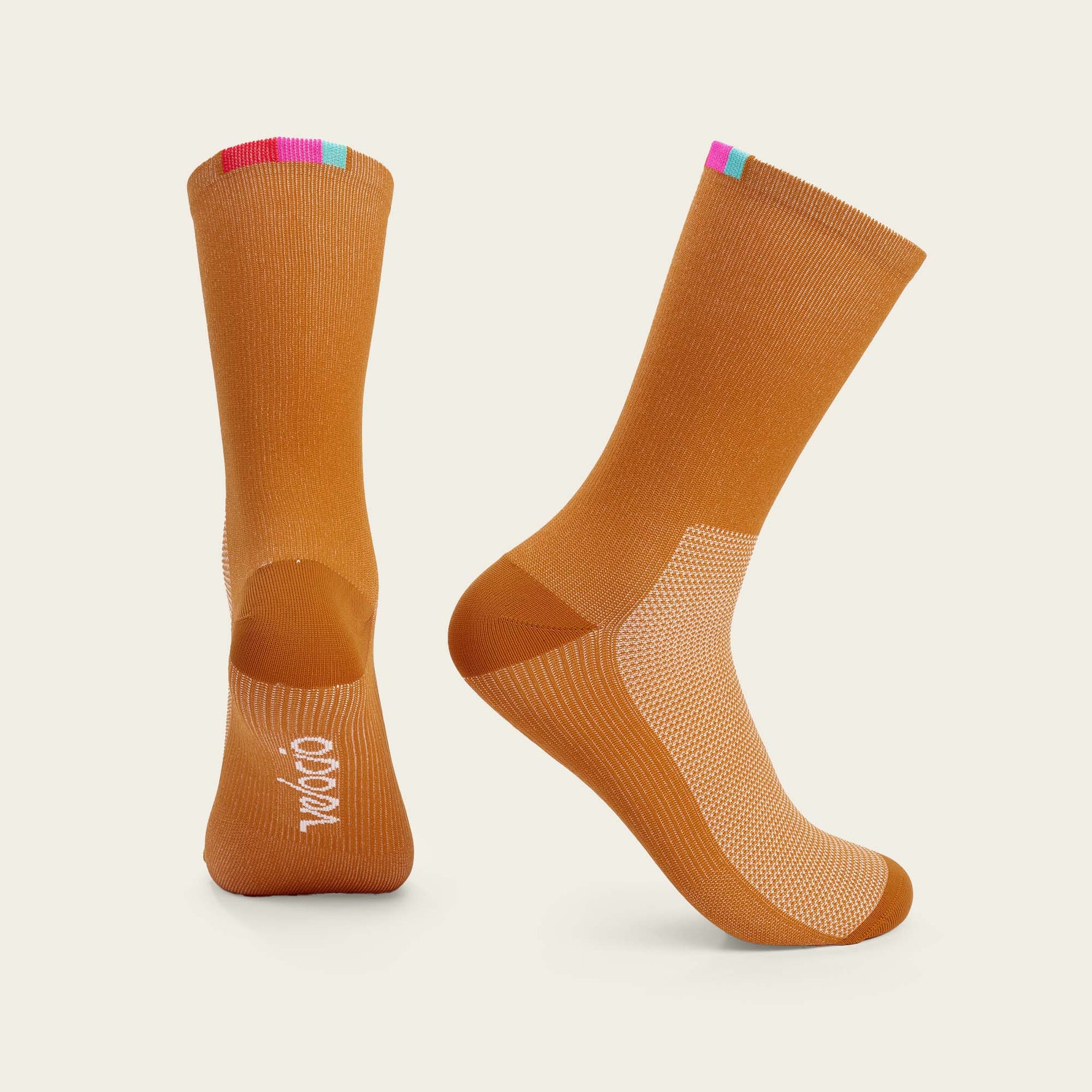 Velocio Terra orange cycling socks with colorful cuff stripes, professional studio photography