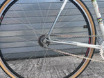 Dual-pivot caliper brake and cockpit with ergonomic grips on vintage Peugeot single speed