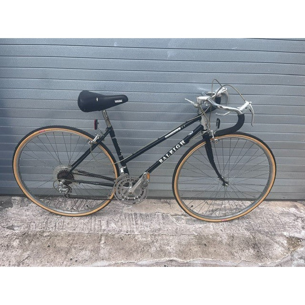 1980s Raleigh Capri 410 road bike in gloss black, full side view