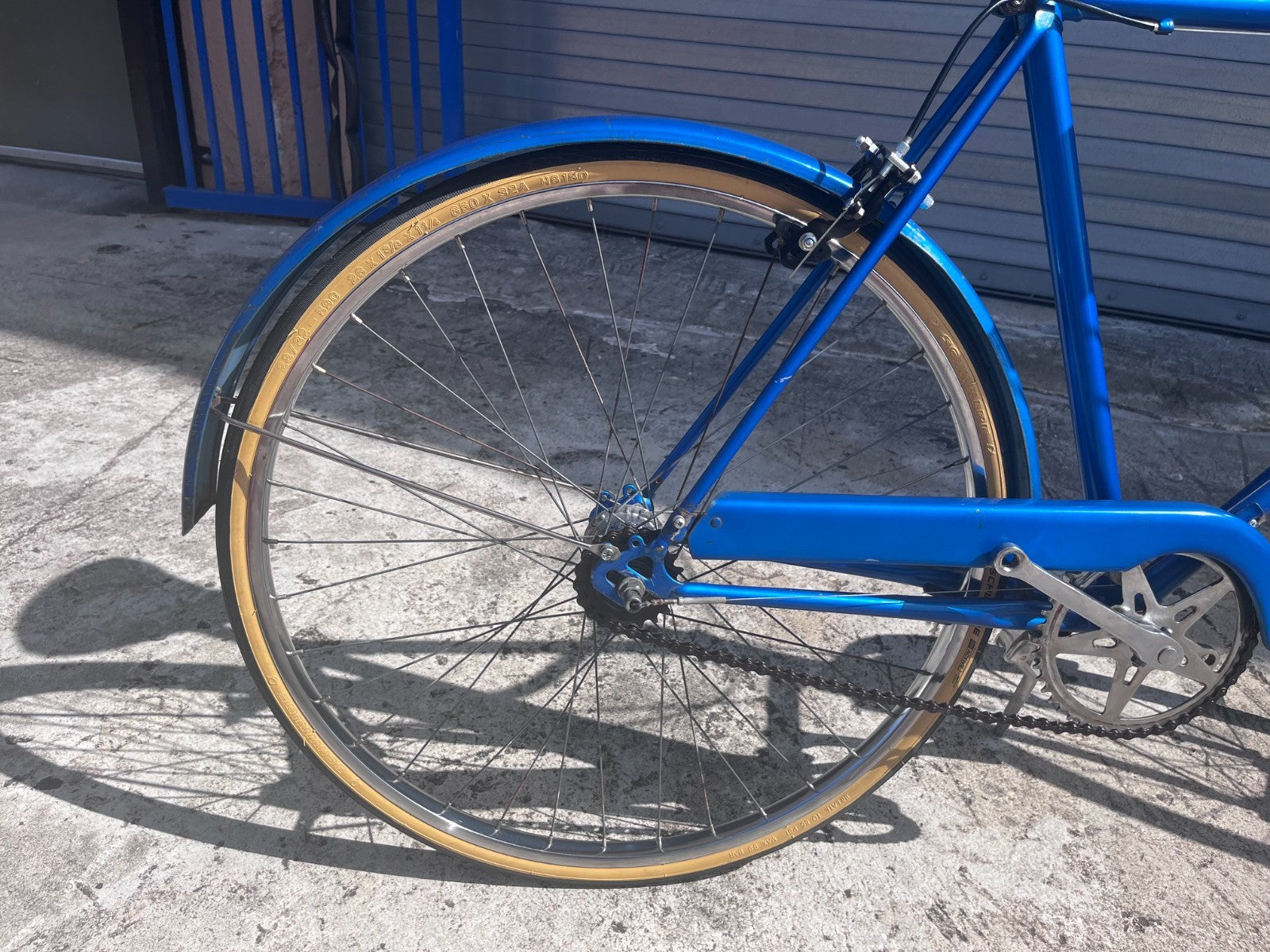 Rear wheel, blue fender and chain guard on the 1970s Sears Free Spirit Sheffield cruiser