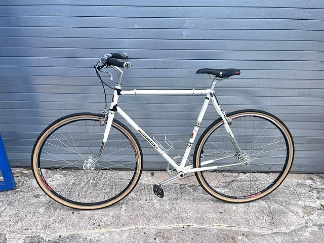Peugeot checkerboard decals on white steel frame of vintage UO-8 single speed