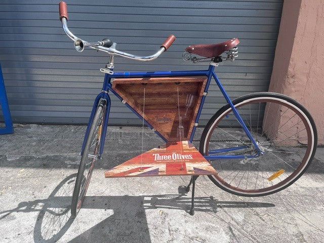 Chrome horn and handlebar detail on Three Olives custom bar cruiser