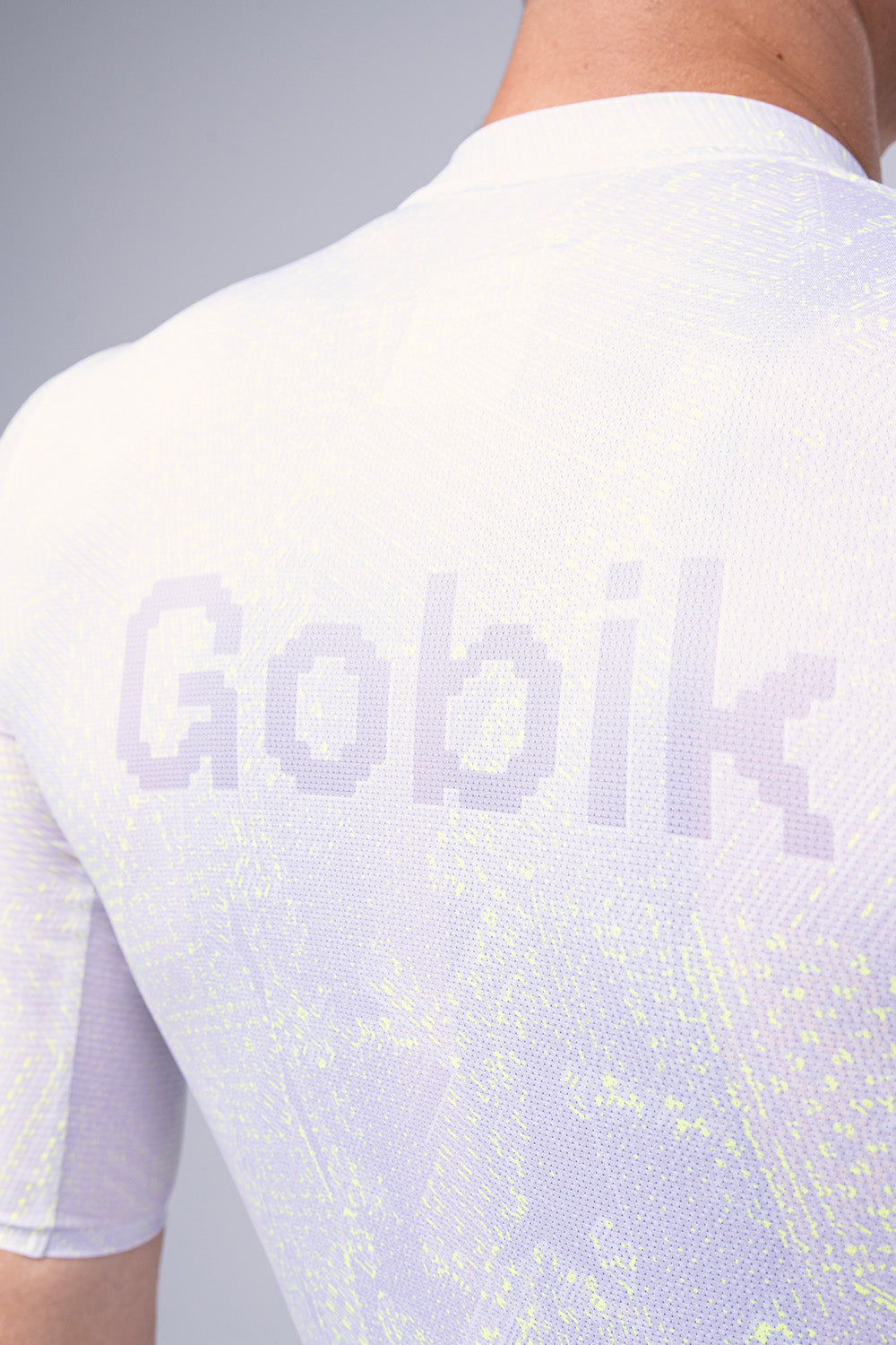 White Gobik cycling jersey with iridescent pattern and Gobik logo on back